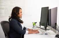 woman in office on computer