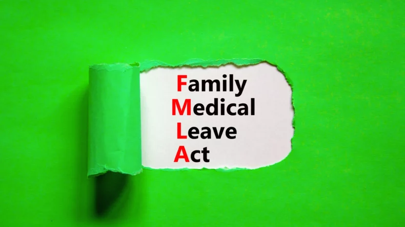 The text Family Medical Leave Act in red and white letters on green background